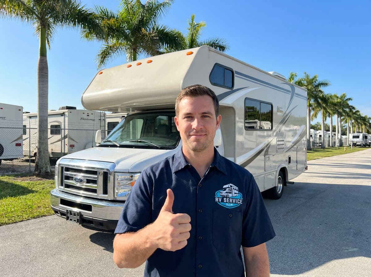 Friendly RV Service Club technician in front of a motorhome at a Florida RV resort